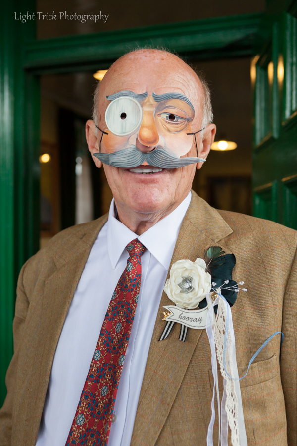wedding guest wearing a disguise